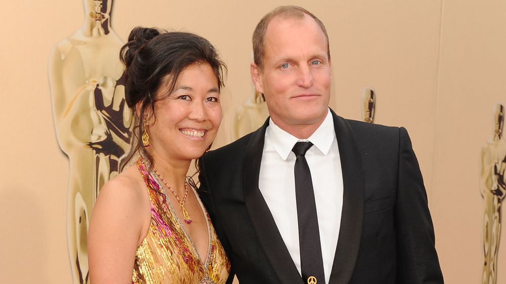 Laura Louie and Woody Harrelson on red carpet