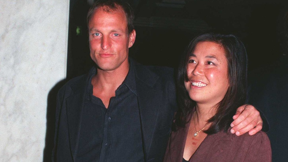 Woody Harrelson and Laura Louie smiling