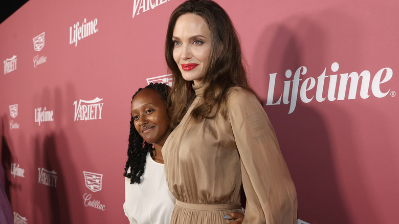 Angelina Jolie holding Zahara Jolie-Pitt