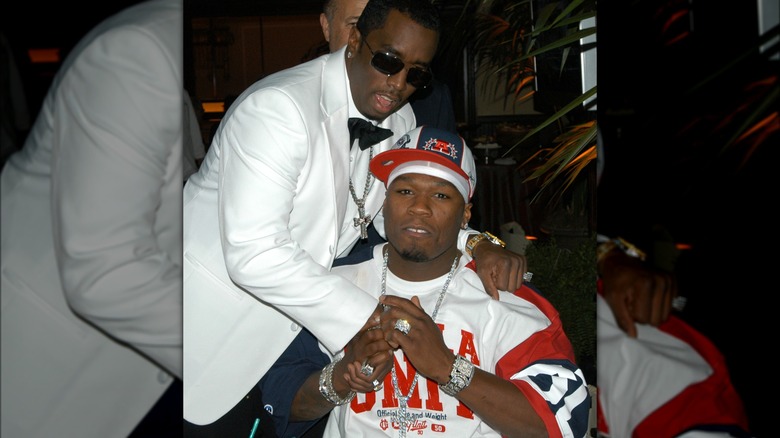 Diddy and 50 Cent posing