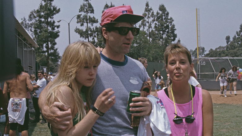 Ed O'Neill and Amanda Bearse at baseball game