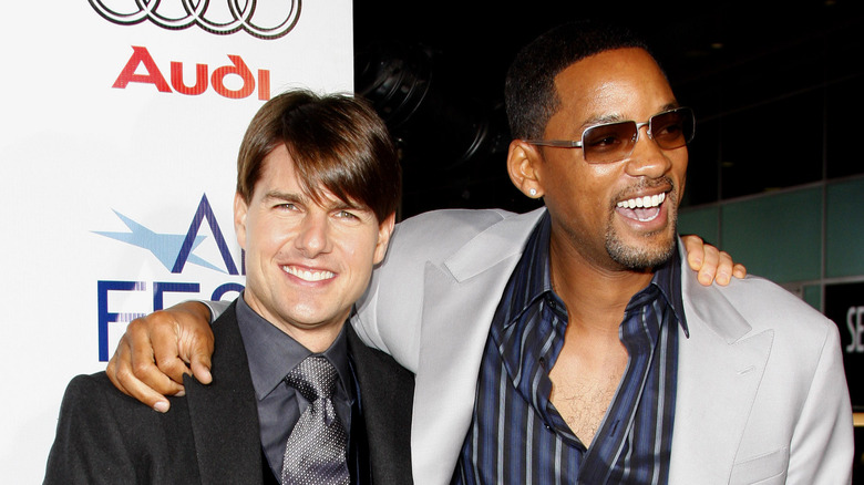 Tom Cruise and Will Smith arms around shoulders