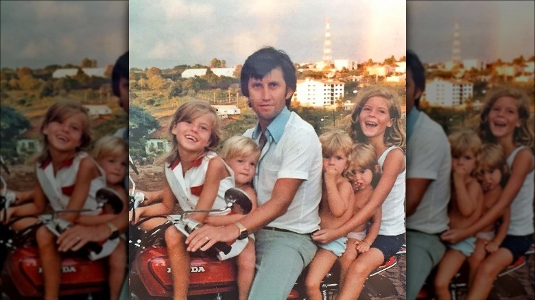 Gisele Bundchen on a bike with her father and sisters