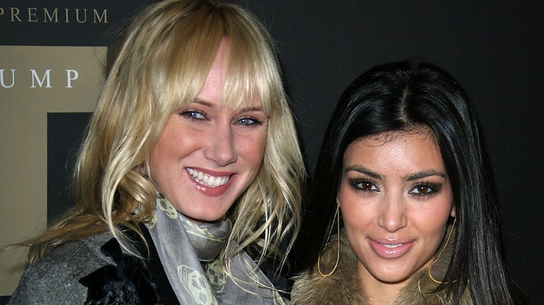 Kimberly Stewart posing with Kim Kardashians