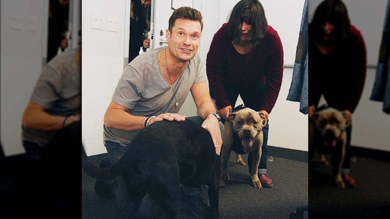 Ryan Seacrest poses with dog