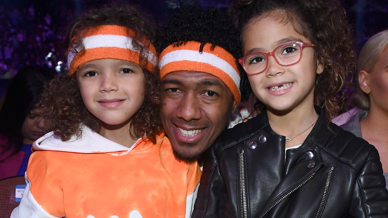 Nick Cannon and Mariah Carey's twins smiling for a picture