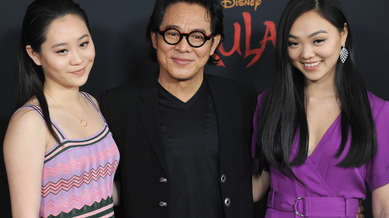 Jet Li posing with daughters