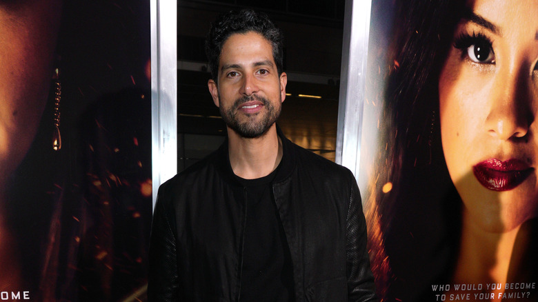 Adam Rodriguez wearing black