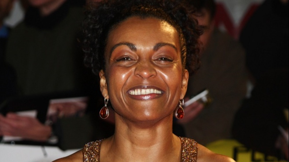 Adjoa Andoh smiling on the red carpet at the UK premiere of Invictus 