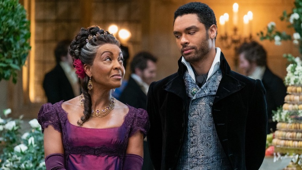 Adjoa Andoh as Lady Danbury and Regé-Jean Page as Simon Basset in Bridgerton