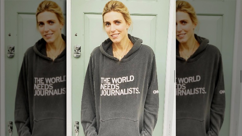 Clarissa Ward, smiling, wearing a journalism sweatshirt 