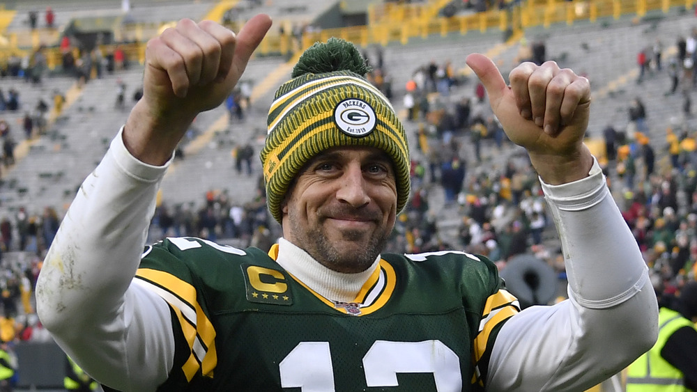 Aaron Rodgers smiling and giving thumbs up