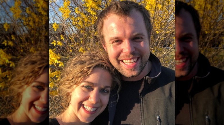 Abbie and John David Duggar smiling in nature