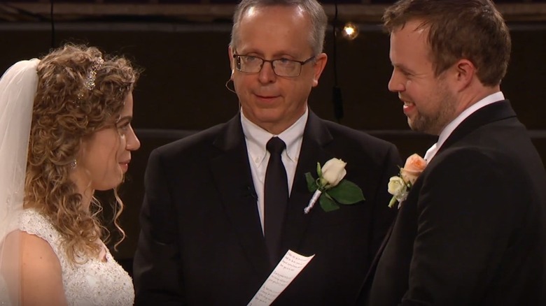 John David and Abbie Duggar at the altar with Abbie's father