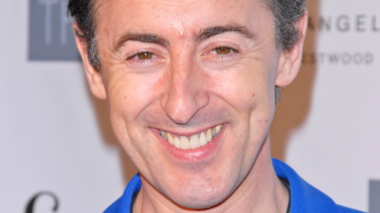 Alan Cumming smiling