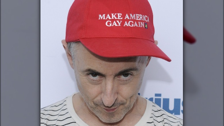 Alan Cumming MAGA parody hat