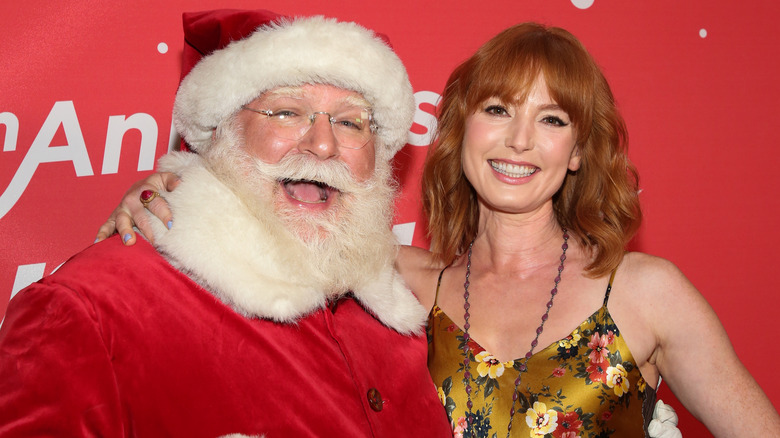 Santa Claus, Alicia Witt, both smiling