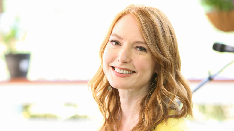 Alicia Witt posing and smiling