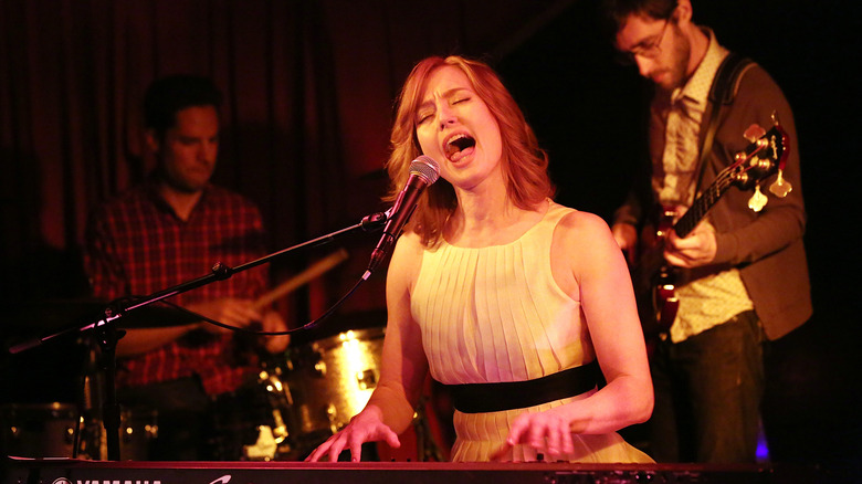 Alicia Witt singing and playing piano