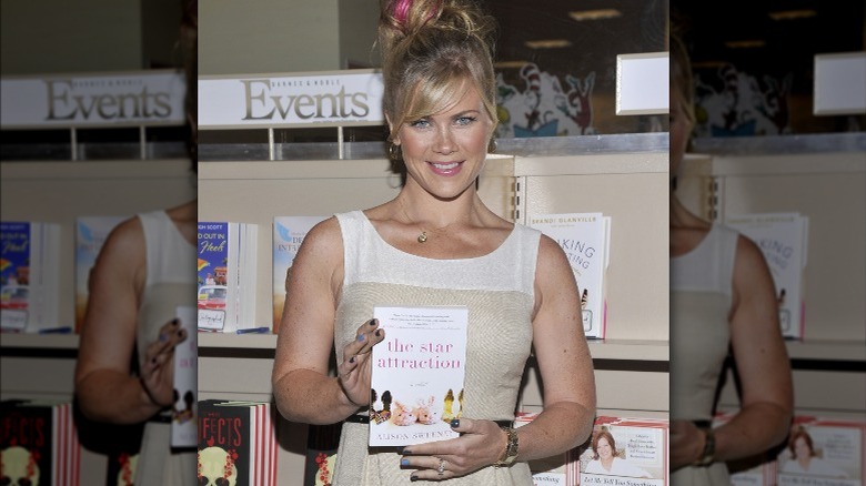 Alison Sweeney holding book