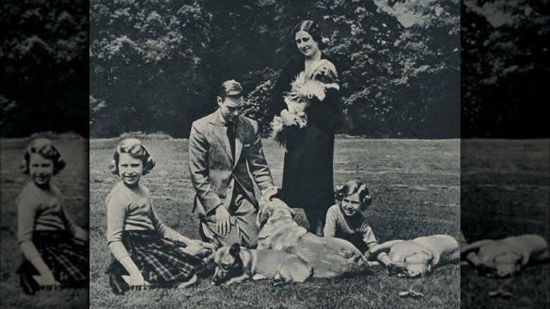 Young Queen Elizabeth and her family with dogs