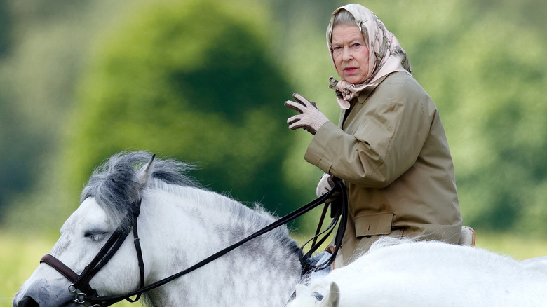 Queen Elizabeth riding a horse 