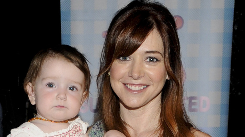 Alyson Hannigan posing with daughter Keeva Denisof