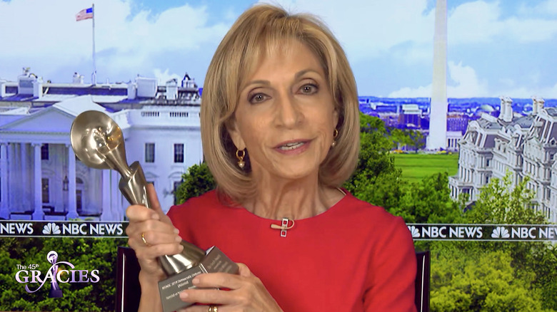 Andrea Mitchell holding an award