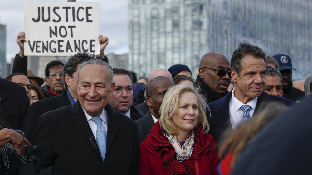 Chuck Schumer, Kirsten Gillibrand, and Andrew Cuomo at a protest