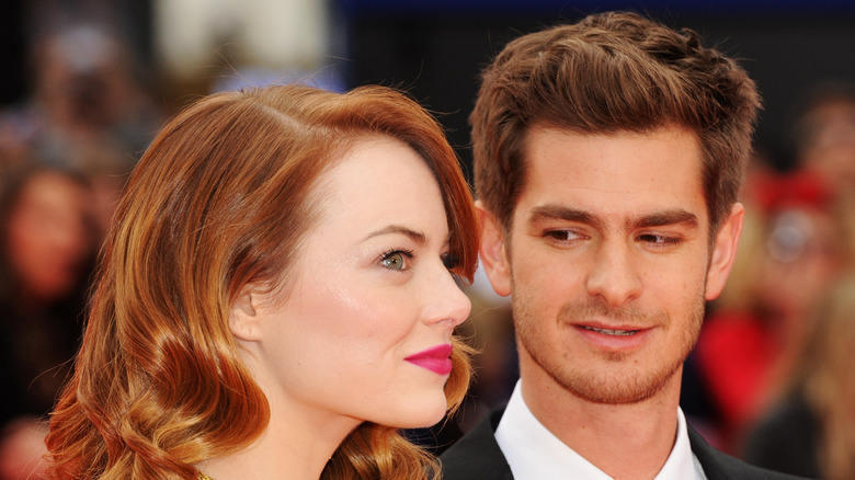 Andrew Garfield glancing at Emma Stone