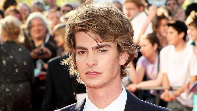 Andrew Garfield with crowd behind him