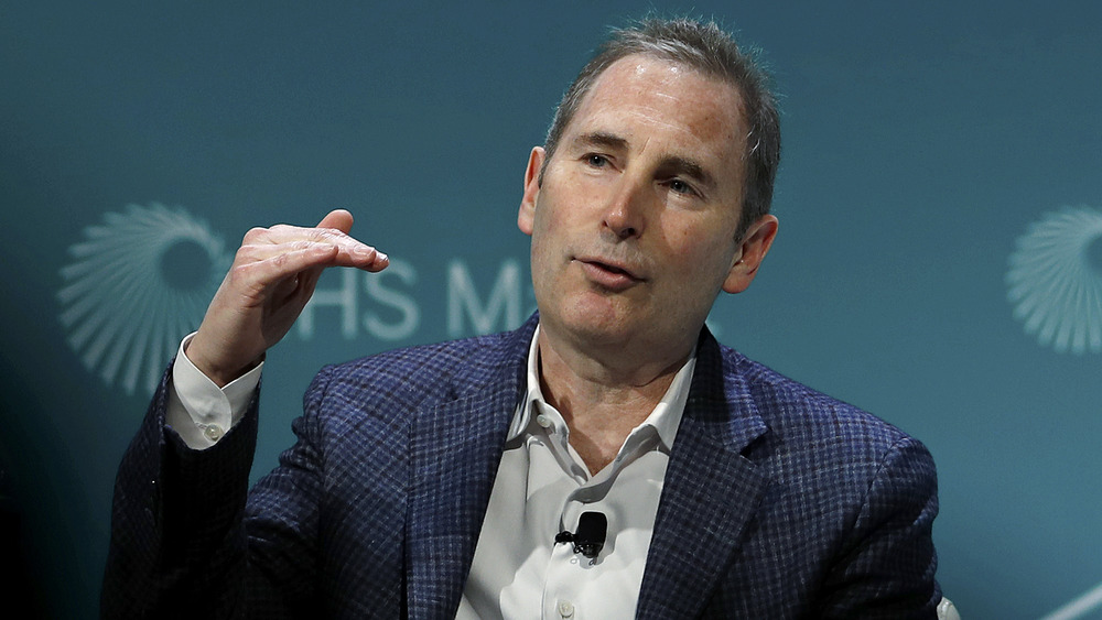 Andy Jassy gestures as he speaks at a conference