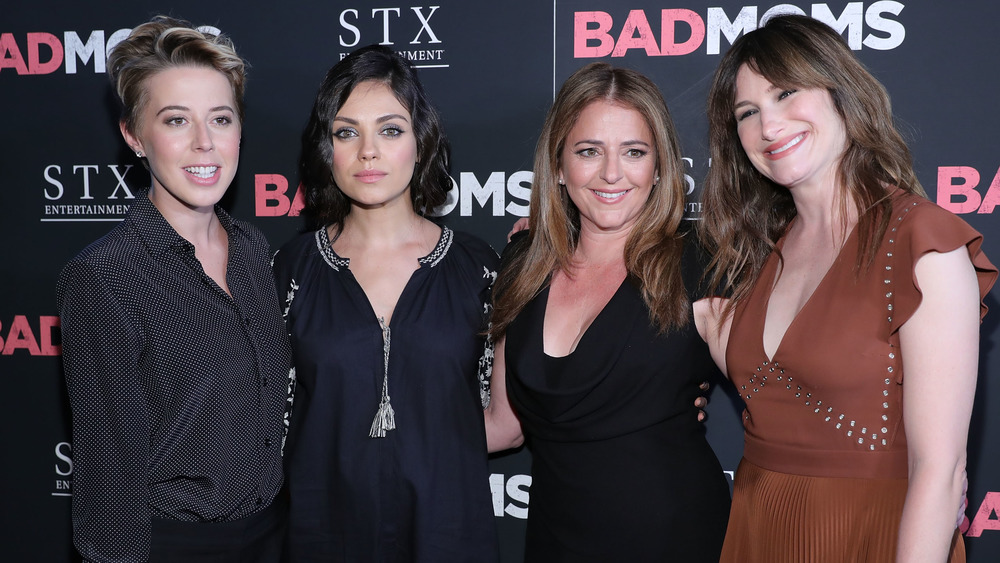 Sophie Watts, Mila Kunis, Annie Mumolo, and Kathryn Hahn on the red carpet