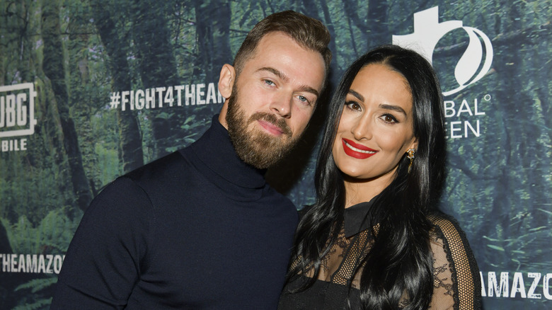 Artem Chigvintsev posing with Nikki Bella