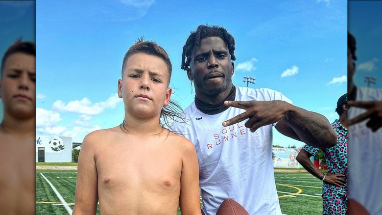 Madden San Miguel posing with Tyreek Hill