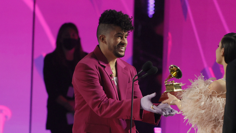 Bad Bunny receiving an award at the 2022 Latin Grammys 