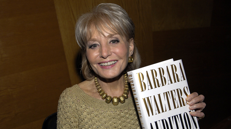 Barbara Walters holding memoir