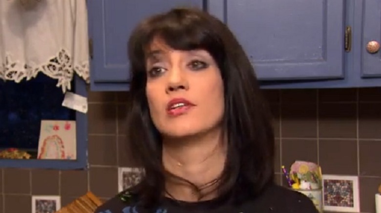 Valerie Dowden Wells in kitchen wearing red lipstick