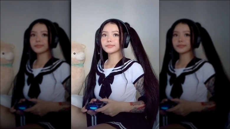 Bella Poarch playing video game in sailor costume