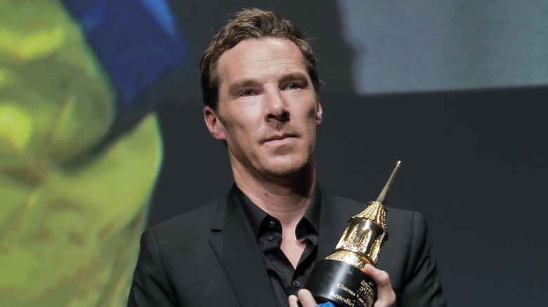 Benedict Cumberbatch holding an award