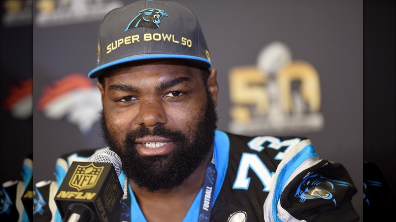 Michael Oher wearing a cap during interview