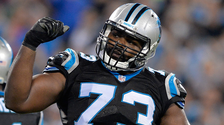 Michael Oher holding a fist up