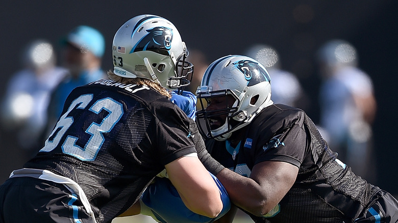 Michael Oher with a teammate