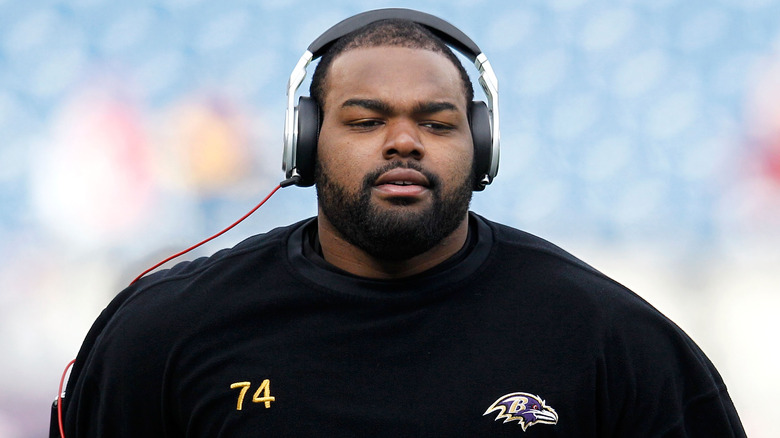 Michael Oher wearing headphones