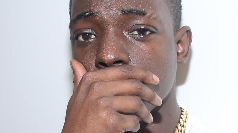 Bobby Shmurda hand on mouth