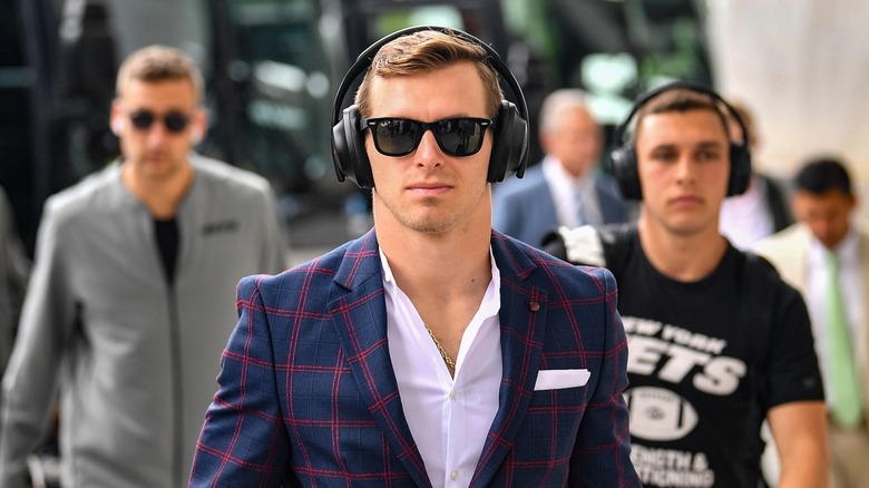 Braxton Berrios walking with headphones on