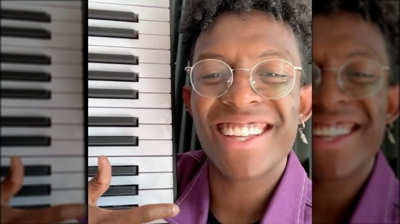 Breland smiling with keyboard