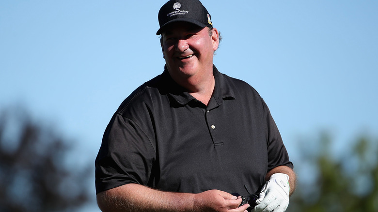 Brian Baumgartner on golf course, laughign