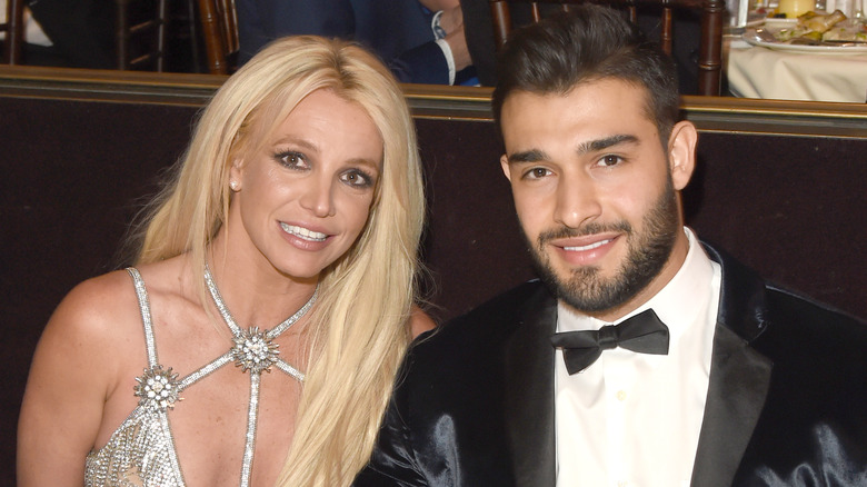 Sam Asghari and Britney Spears pose together