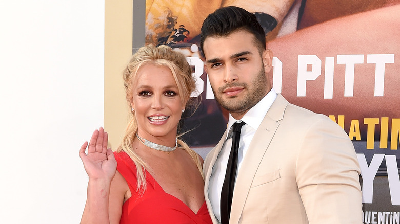 Sam Asghari and Britney Spears pose together